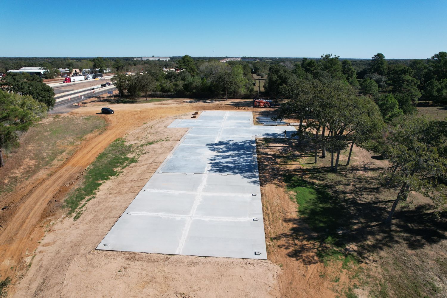 aerial view 2 of concrete slab foundation for 50x235 metal building near Columbus Texas